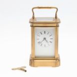 A FRENCH GILT BRASS CARRIAGE CLOCK.