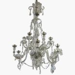 A 20TH CENTURY CUT GLASS TWELVE BRANCH CHANDELIER.