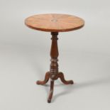 A 19TH CENTURY MAHOGANY AND SATINWOOD TRIPOD TABLE.