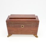 A REGENCY ROSEWOOD AND BRASS INLAID TEA CADDY.