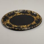 A 19TH CENTURY OVAL BLACK LACQUERED TRAY.