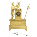 A FRENCH GILT EMPIRE STYLE MANTEL CLOCK.