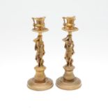 A PAIR OF EMPIRE STYLE ORMOLU FIGURAL CANDLESTICKS.
