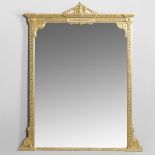 AN EARLY 20TH CENTURY GILT OVERMANTEL MIRROR.