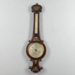 A 19TH CENTURY ROSEWOOD AND MOTHER OF PEARL ANEROID BAROMETER.