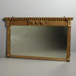 A 19TH CENTURY GILT OVERMANTEL MIRROR.