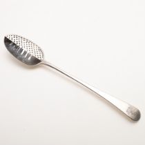 A GEORGE III OLD ENGLISH PATTERN STRAINER SPOON.
