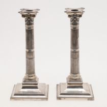 A PAIR OF VICTORIAN CANDLESTICKS.