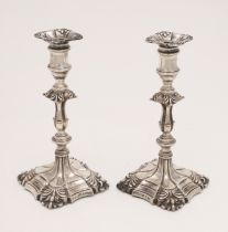 A PAIR OF VICTORIAN CANDLESTICKS.