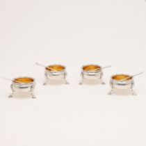 A SET OF FOUR GEORGE II CIRCULAR SALTS.