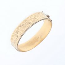 A 9CT GOLD HALF HINGED BANGLE.