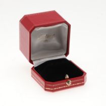 A RED LEATHER RING BOX BY CARTIER.