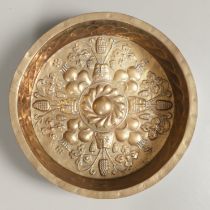 AN ANTIQUE BRASS REPOUSSE ALMS BOWL.