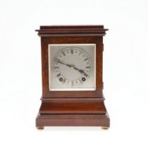 A WINTERHALDER & HOFMEIER FOUR GLASS MAHOGANY MANTEL CLOCK.