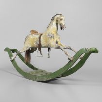 A 19TH CENTURY PAINTED ROCKING HORSE.