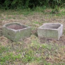 A PAIR OF 18TH CENTURY STONE TROUGHS.