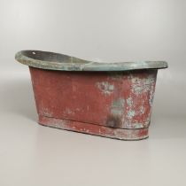 A 19TH CENTURY COPPER ROLL TOP BATH.