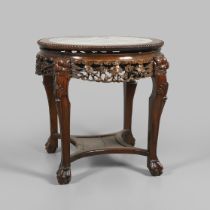 A CHINESE CARVED HARDWOOD CENTRE TABLE.