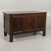 A 17TH CENTURY PANELLED OAK COFFER.