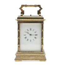 A LARGE FRENCH BRASS REPEATING CARRIAGE CLOCK.