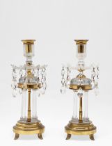 A PAIR OF CUT GLASS AND GILT METAL CANDLESTICK TABLE LUSTRES.