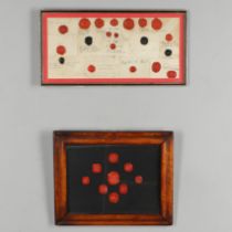A COLLECTION OF ANTIQUE RED AND BLACK WAX SEALS.