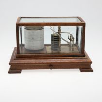 AN EARLY 20TH CENTURY OAK CASED BAROGRAPH.