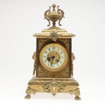 A FRENCH GILT BRASS MANTEL CLOCK.