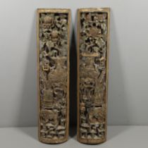 A PAIR OF CARVED CHINESE PANELS.