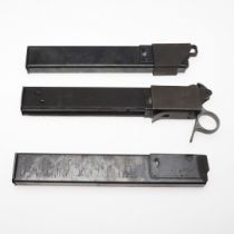 THREE STEN GUN MAGAZINES AND TWO DIFFERENT LOADING TOOLS.