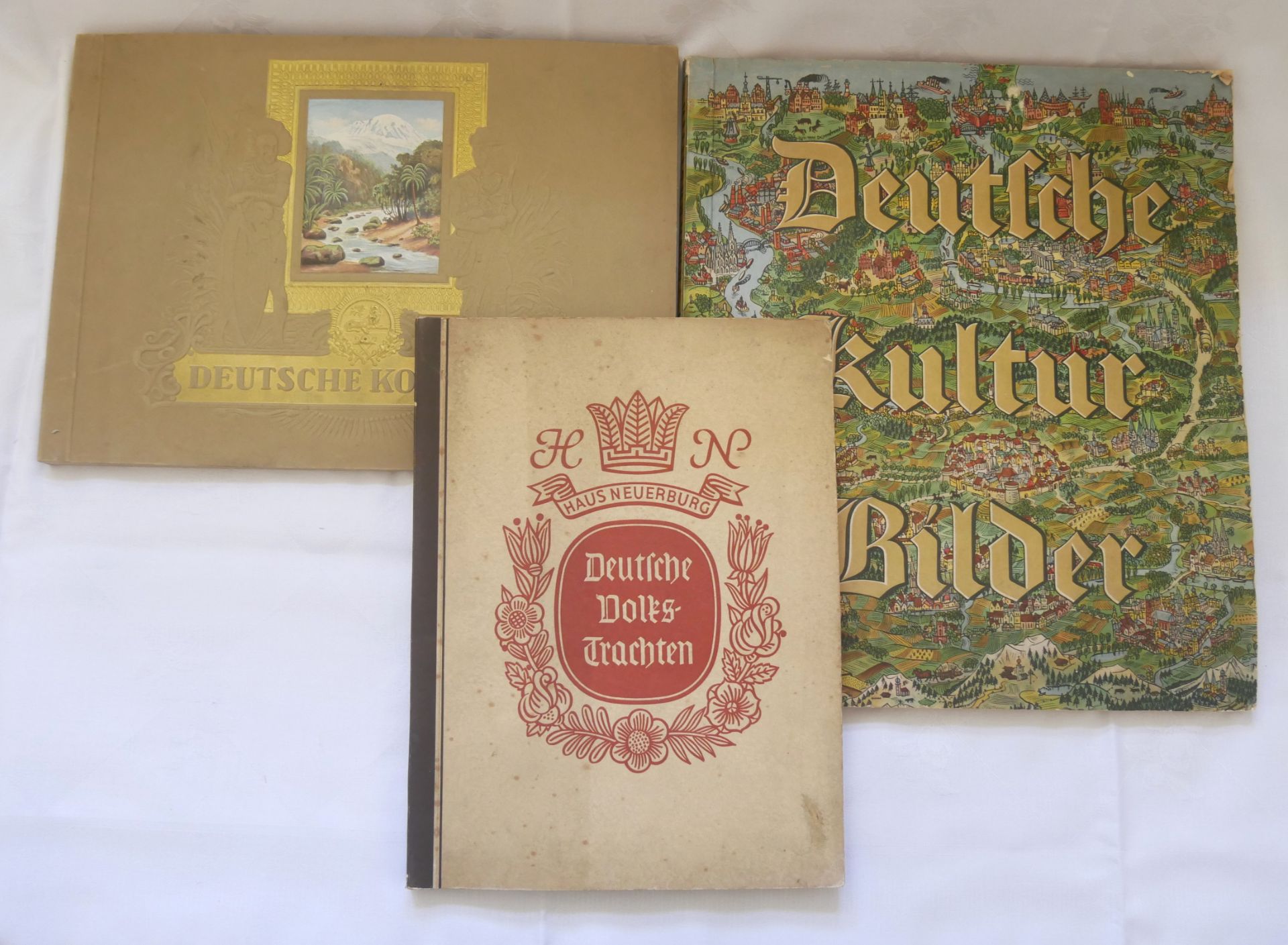 Konvolut von 3 Sammelbilder Alben zum Thema deutsche Geschichte & Tradition, dabei: deutsche