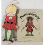 Struwwelpeter - Buch, dazu Struwwelpeter als Hampelmann. Holz. Höhe: ca. 29 cm.