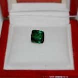 AN UNMOUNTED GREEN TOURMALINE, 4CT, WITH 'JEWELLERY CHANNEL' CERTIFICATE OF AUTHENTICITY IN SQUARE-