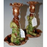 A PAIR OF 19TH CENTURY VICTORIAN POTTERY CANDLESTICKS DECORATED WITH PINE CONES AND FOLIAGE