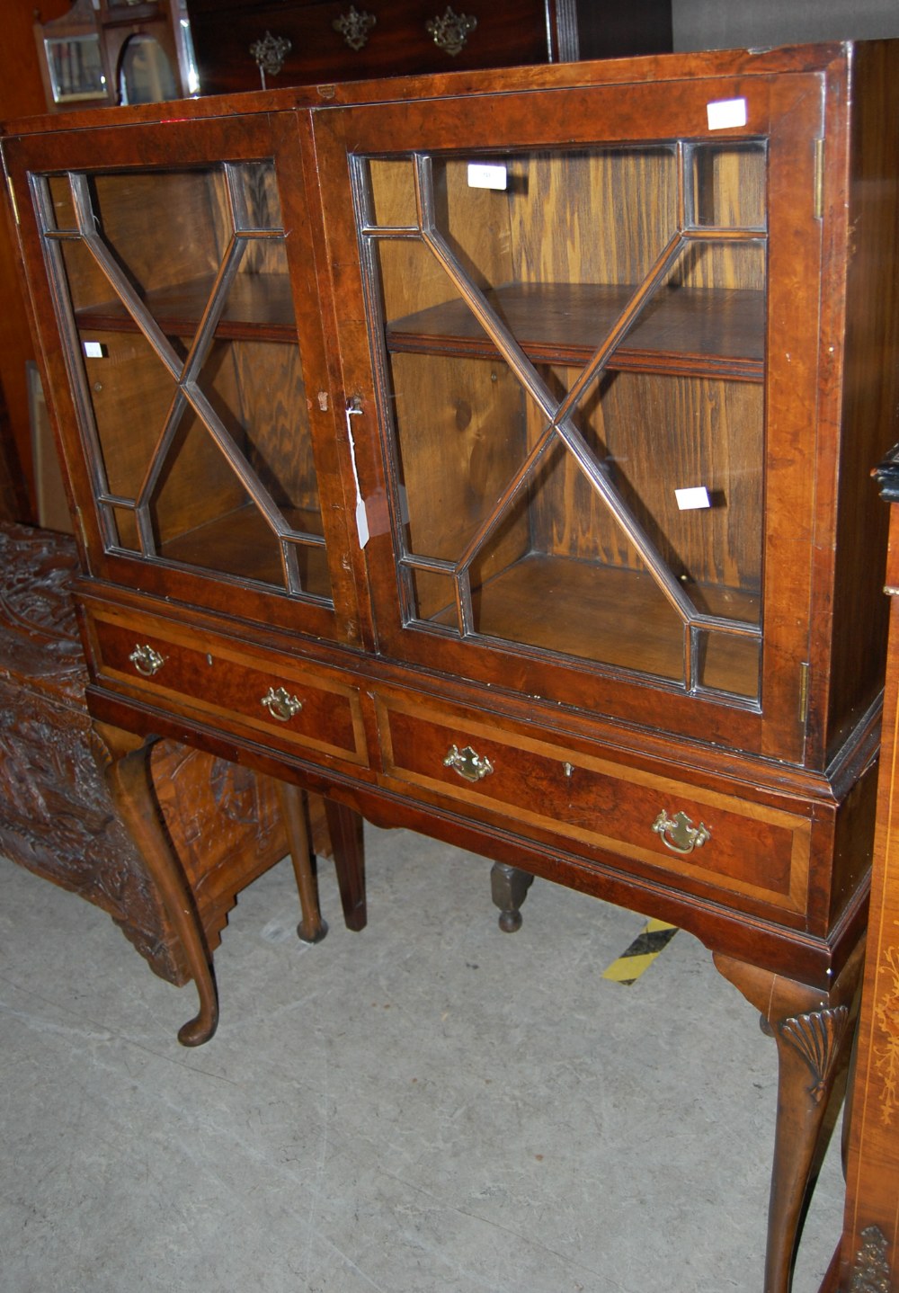 AN EARLY 20TH CENTURY WALNUT DISPLAY CABINET ON STAND, FITTED WITH PAIR OF ASTRAGAL GLAZED