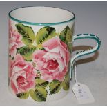 A WEMYSS POTTERY TANKARD DECORATED WITH ROSES, IMPRESSED MARK AND YELLOW PAINTED MARK