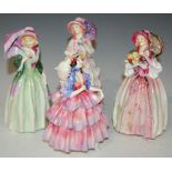 FOUR ROYAL DOULTON FIGURES TO INCLUDE 'MISS DEMURE' HN1463, 'THE HINGED PARASOL' HN1579, 'JUNE'