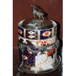 AN EP-MOUNTED DAVENPORT POTTERY BISCUIT BARREL, THE COVER WITH STAG FINIAL