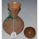 AN ANTIQUE TERRACOTTA POTTERY VASE WITH INCISED LINE DECORATION OF STYLISED FOLIAGE AND SCROLLS,