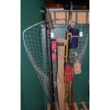 A COLLECTION OF ASSORTED FISHING RODS AND A LANDING NET