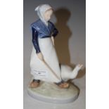 A ROYAL COPENHAGEN PORCELAIN FIGURE GROUP MODELLED WITH DUTCH GIRL AND GOOSE