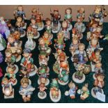 A LARGE GROUP OF GOEBEL AND HUMMEL FIGURES
