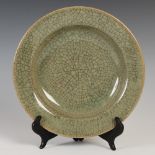 A CHINESE PORCELAIN CELADON GROUND CRACKLE GLAZE DISH, FOUR CHARACTER CHENGUA MARK BUT LATER, 24CM
