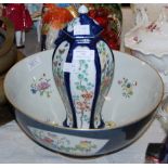 A 19TH CENTURY POWDER BLUE GROUND FAMILLE ROSE STYLE PUNCH BOWL DECORATED WITH PANELS OF FLOWERS,