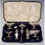 A LONDON SILVER CASED SEVEN-PIECE CRUET SET