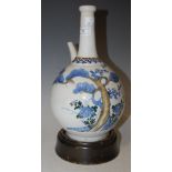 A JAPANESE BLUE AND WHITE PORCELAIN KENDI TYPE EWER, DECORATED WITH PINE TREES AND FLOWERS, 28CM