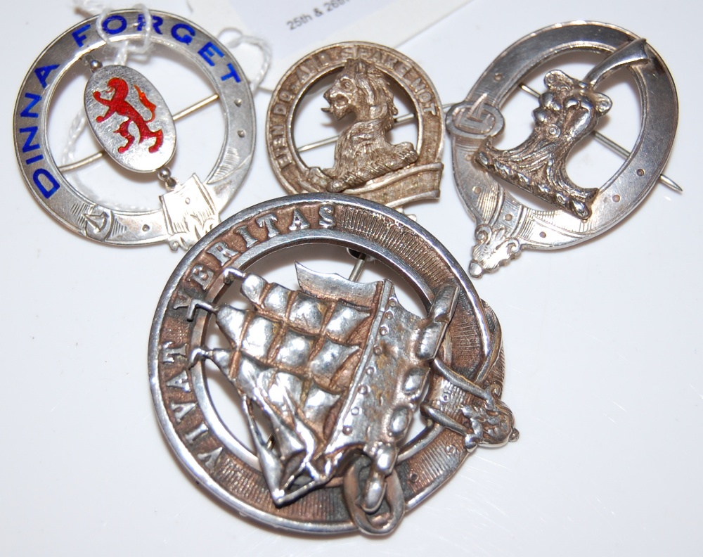 FOUR ASSORTED SCOTTISH CLAN BADGES, THREE SILVER AND ONE WHITE METAL