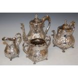 A 19TH CENTURY ELECTROPLATED FOUR-PIECE TEA SET, THE TEAPOT WITH BEARDED MALE FINIALS, THE SPOUTS