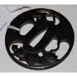 AN ANTIQUE JAPANESE METAL TSUBA WITH MINOGAME DETAIL, 6CM HIGH X 5.6CM WIDE