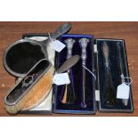 A BIRMINGHAM SILVER AND TORTOISESHELL MOUNTED THREE PIECE DRESSING TABLE SET COMPRISING HAND-HELD